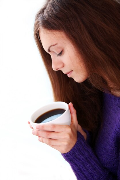 Woman holding a cup of coffee