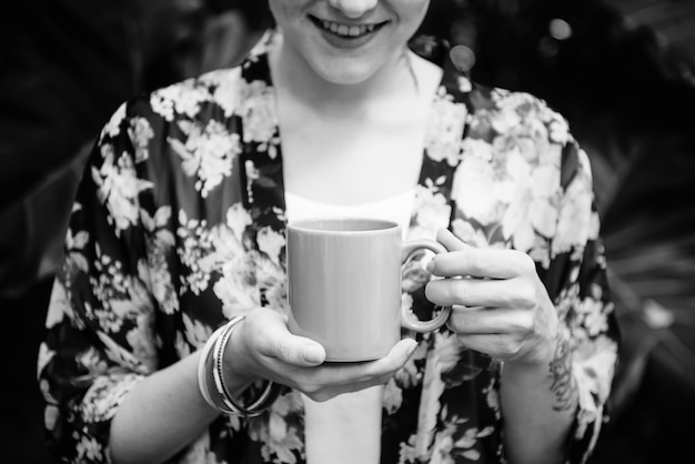 Woman holding a cup of coffee