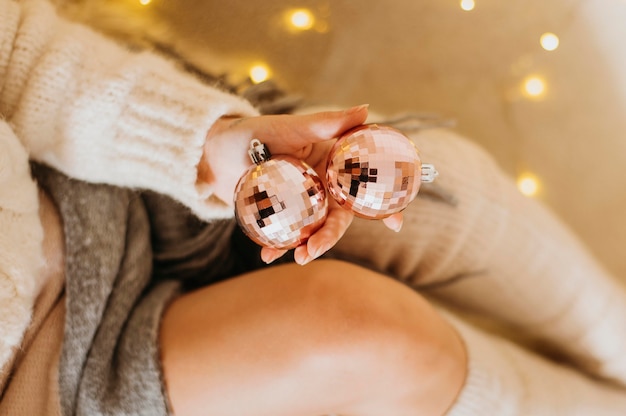 Woman holding decorative tree balls