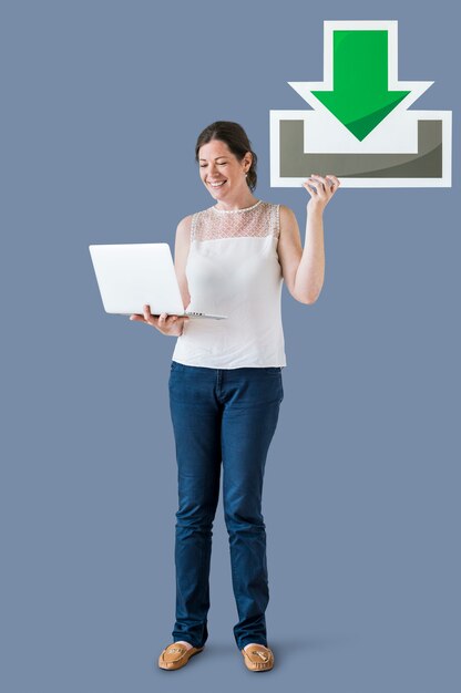 Woman holding a download icon and a laptop