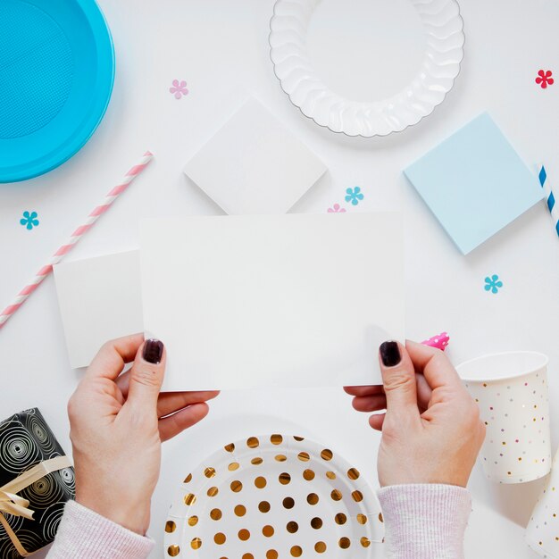 Woman holding empty birthday card