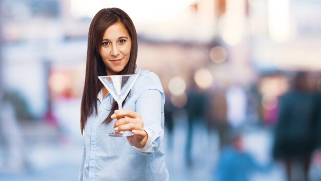 Woman holding an empty glass