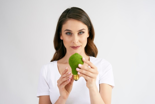 Woman holding a energy efficient light bulb