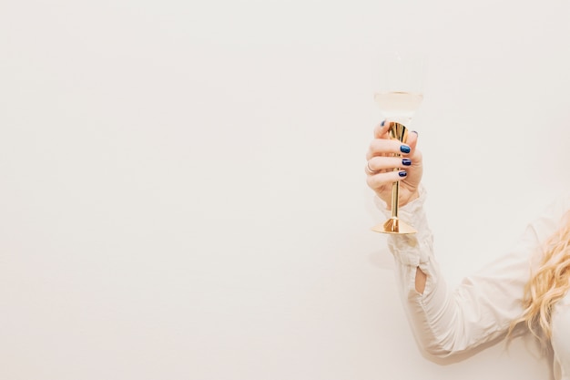 Woman holding glass of champagne
