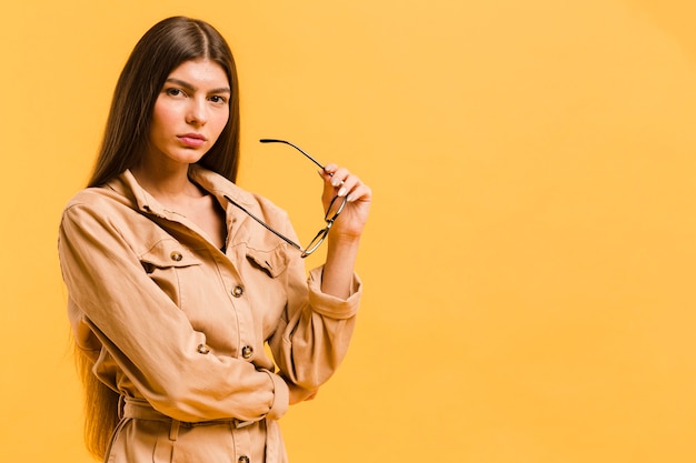 Woman holding glasses with copy space