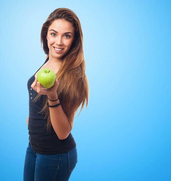 Woman holding a green apple