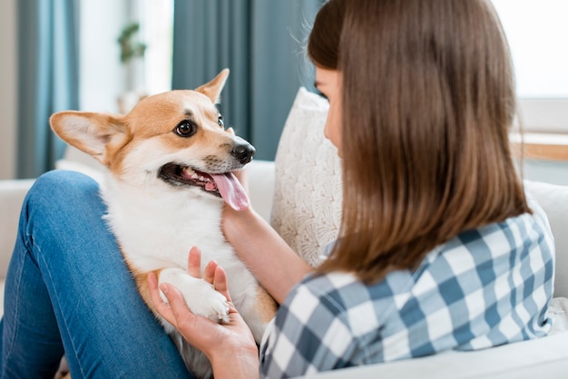 Woman holding her cute dog