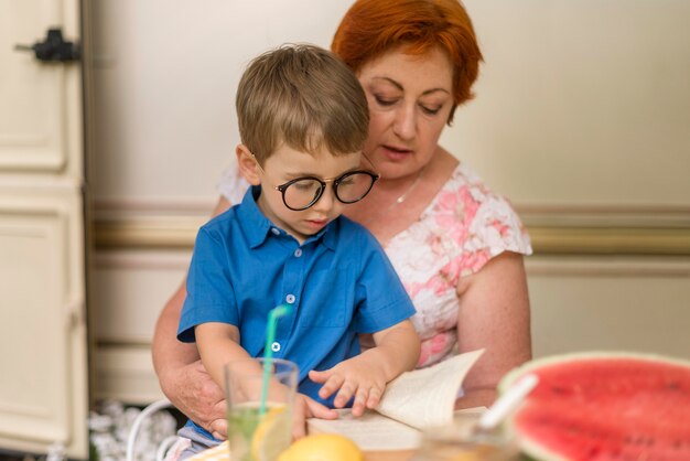 Woman holding her grandson in her lap