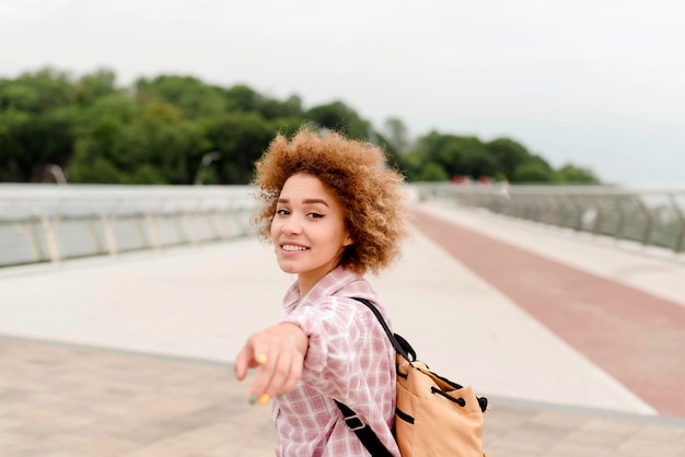 Woman holding her hand in front of her