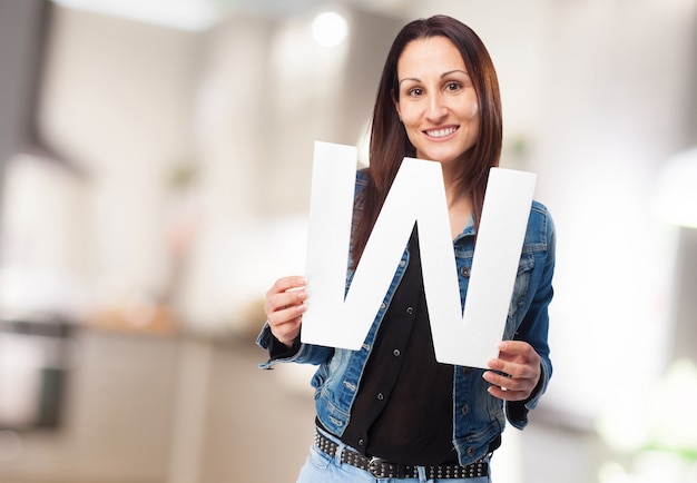 Woman holding letter "w"