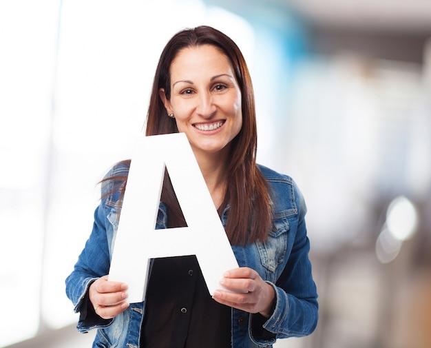 woman holding the A letter