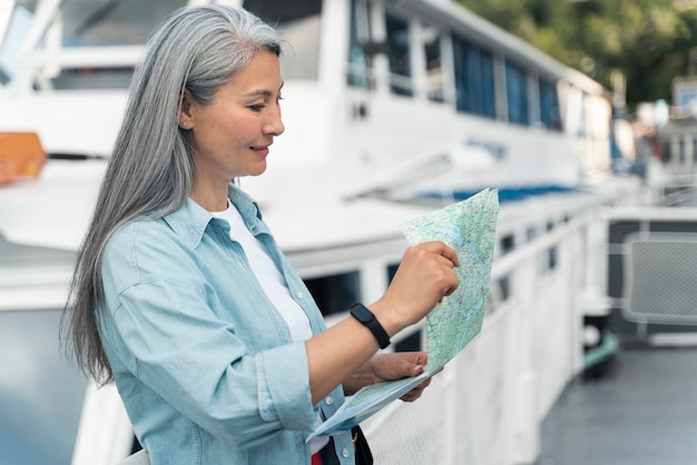 Woman holding map medium shot