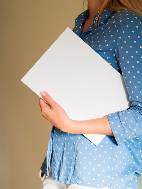 Woman holding a mock-up magazine