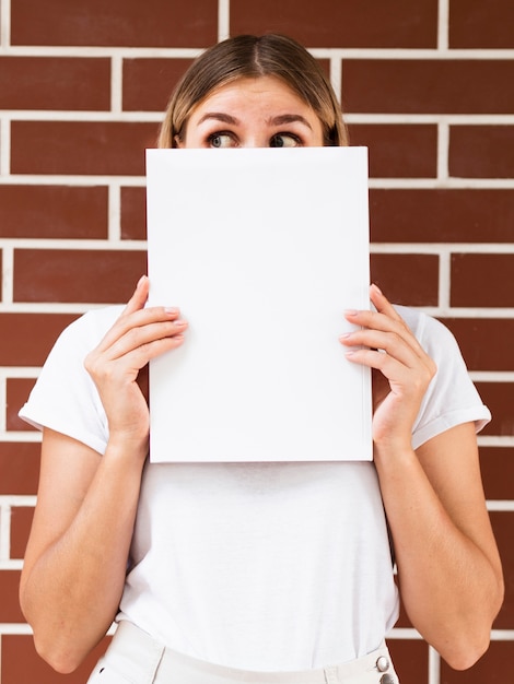 Woman holding a mock-up magazine