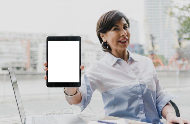 woman holding a mockup tablet