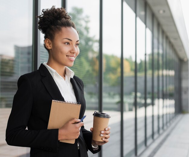 Woman holding notepad medium shot