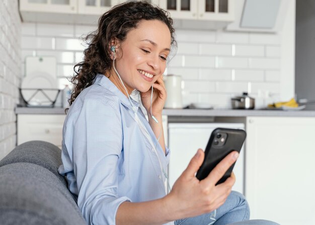 Woman holding phone medium shot