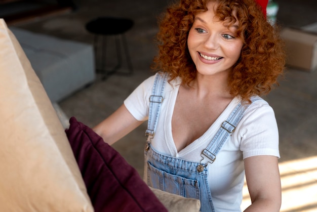 Woman holding pillows for decorating new home