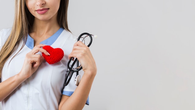 Woman holding a plush heart