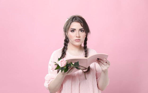 Free photo woman holding roses not impressed by book