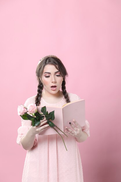 Woman holding roses shocked by what she's reading in book