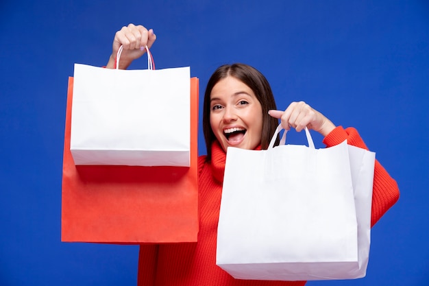 Woman holding shopping bags mediums hot