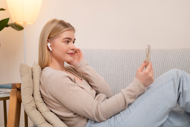 Woman holding smartphone medium shot