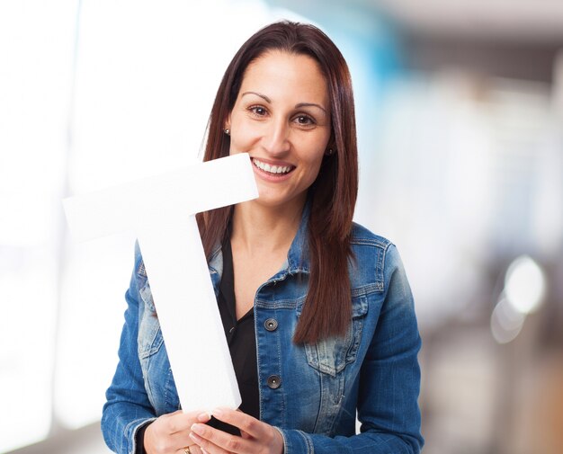 woman holding the T letter