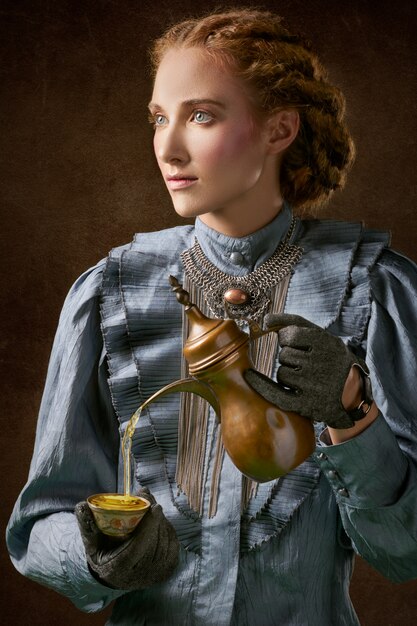 Woman holding turkich teapot 