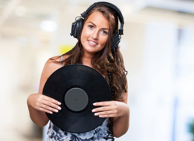 woman holding a vinyl