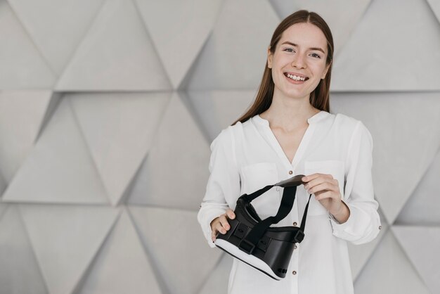 Woman holding virtual reality headset