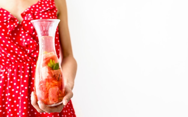 Free photo woman holding watermelon juice