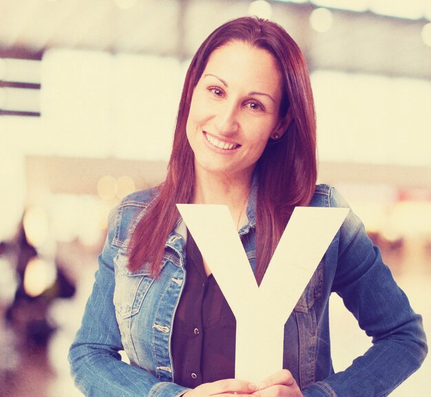 woman holding the Y letter