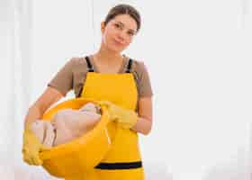 Free photo woman holding yellow basket