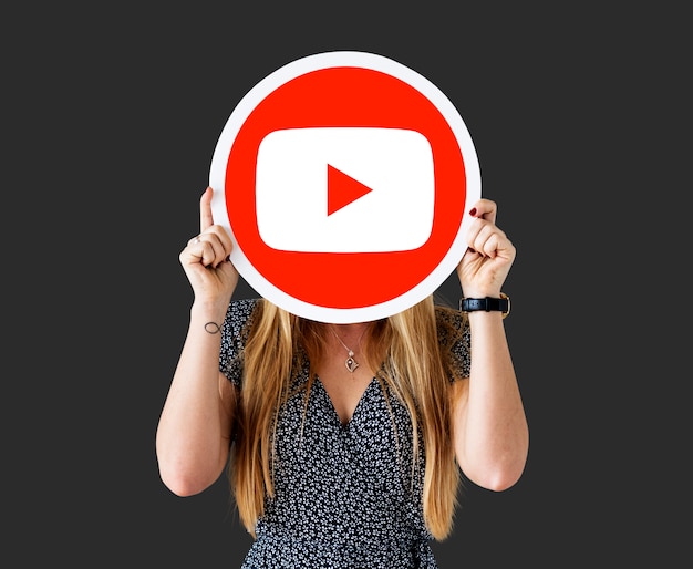 Woman holding a YouTube icon