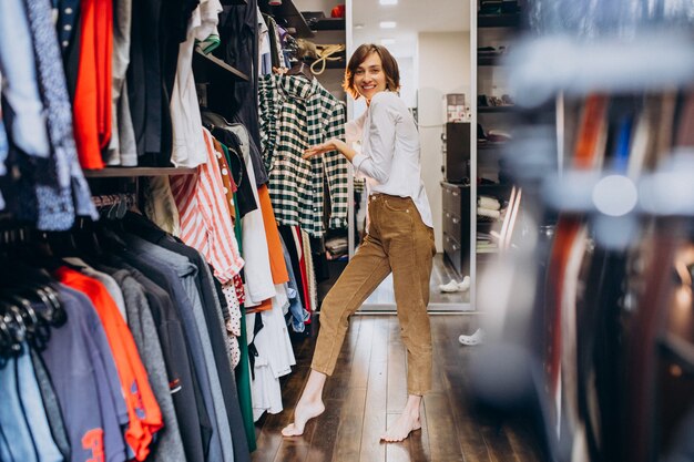 Woman at home choosing cloth from her check-room