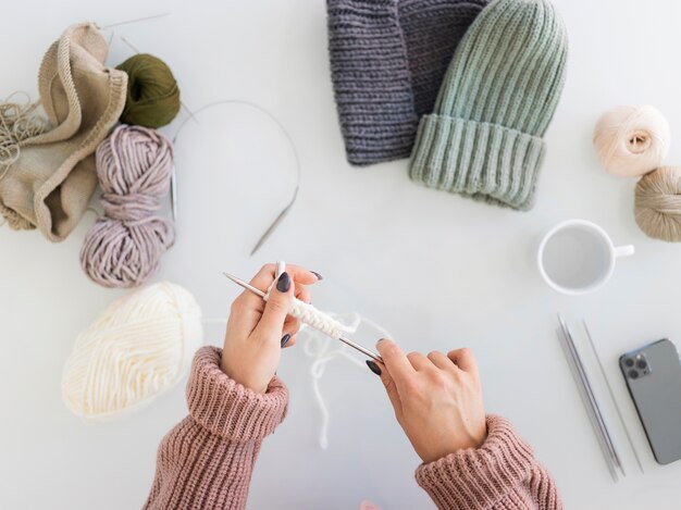 Woman at home knitting close up