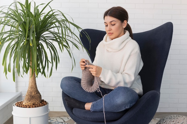Woman at home knitting