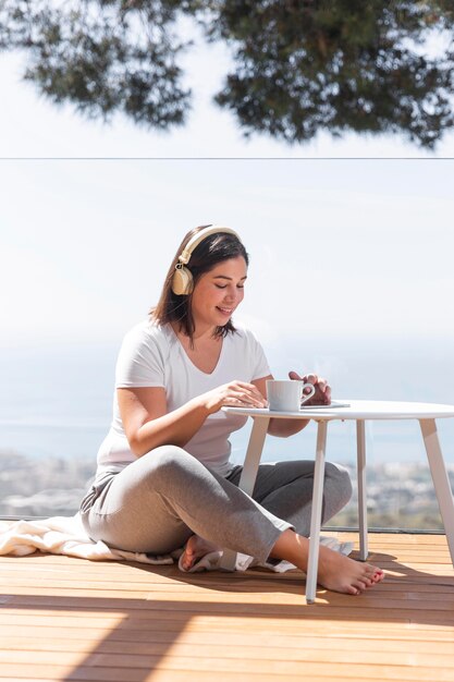 Woman at home listening music