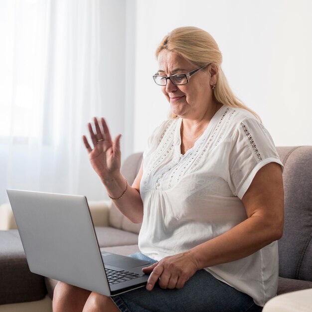 Woman at home in quarantine having a video call