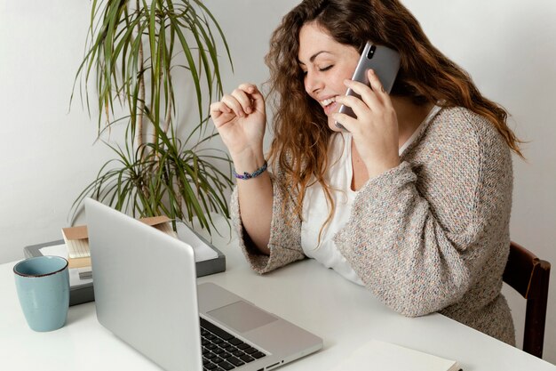 Woman at home using laptop