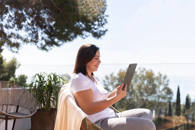 Woman at home using tablet