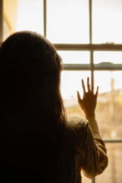 Woman at home with mysterious lights around her