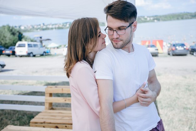 Woman hugging her boyfriend from behind