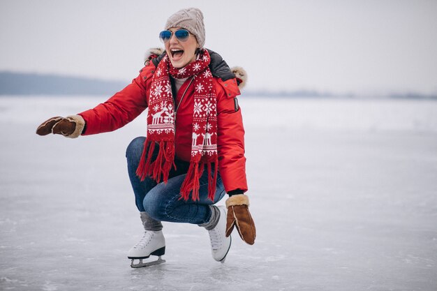 Woman ice skating at the lake