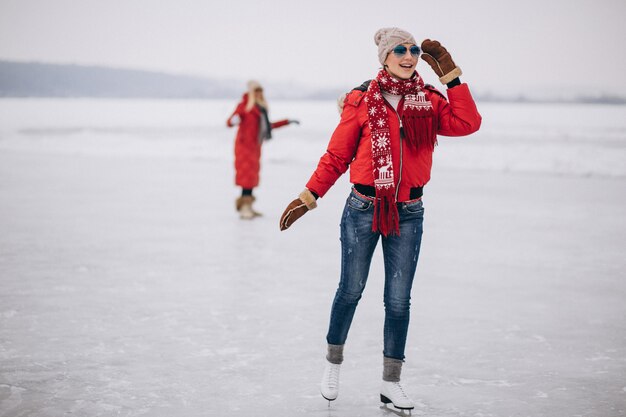 Woman ice skating at the lake