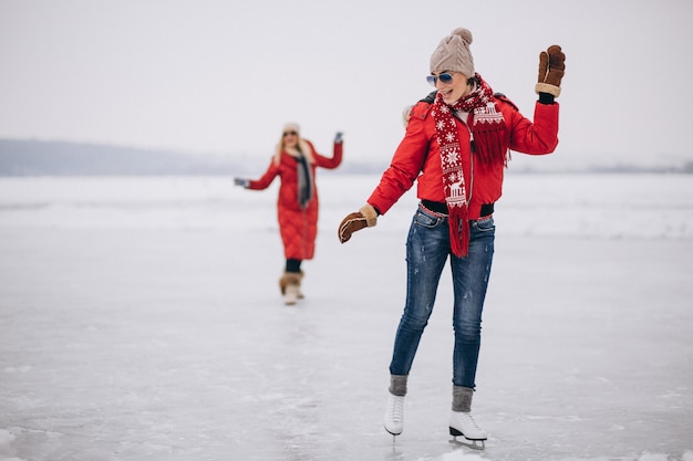 Woman ice skating at the lake