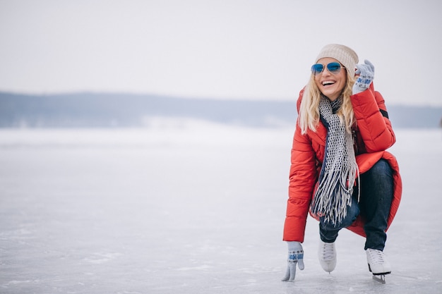 Free photo woman ice skating at the lake