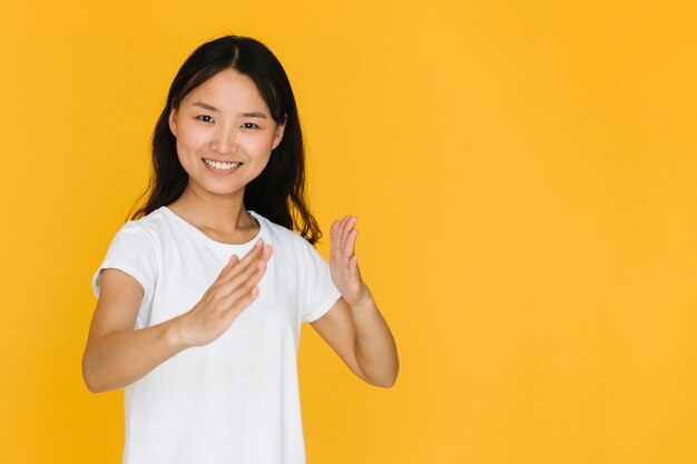 Woman imitating a karate move