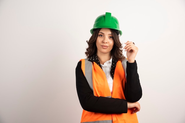 Woman industrial worker posing on white